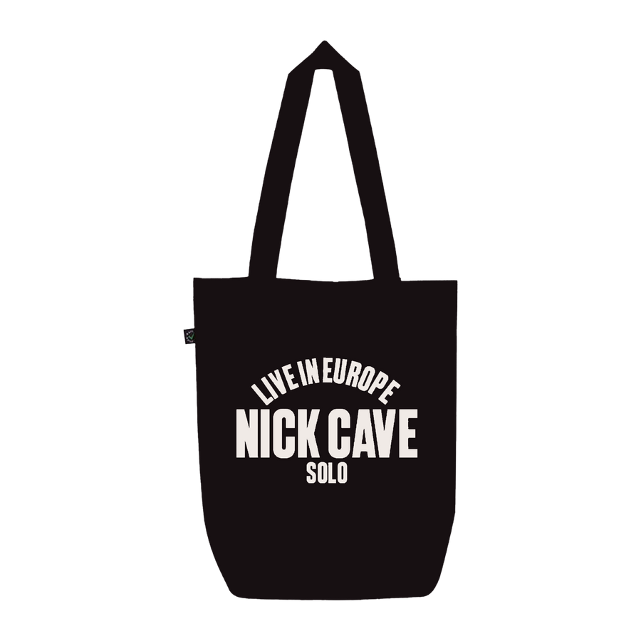 Black tote bag with white text 'LIVE IN EUROPE NICK CAVE SOLO' 